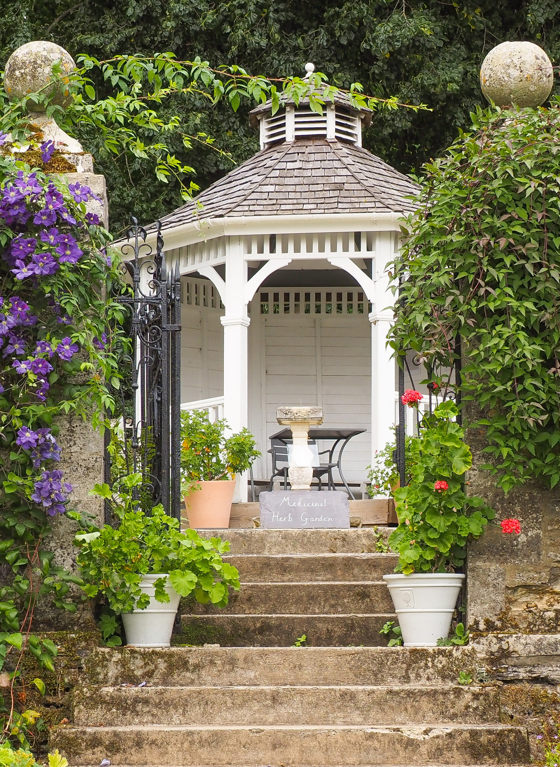 The steps leading up to a lovely hexagonal gazebo seating area.