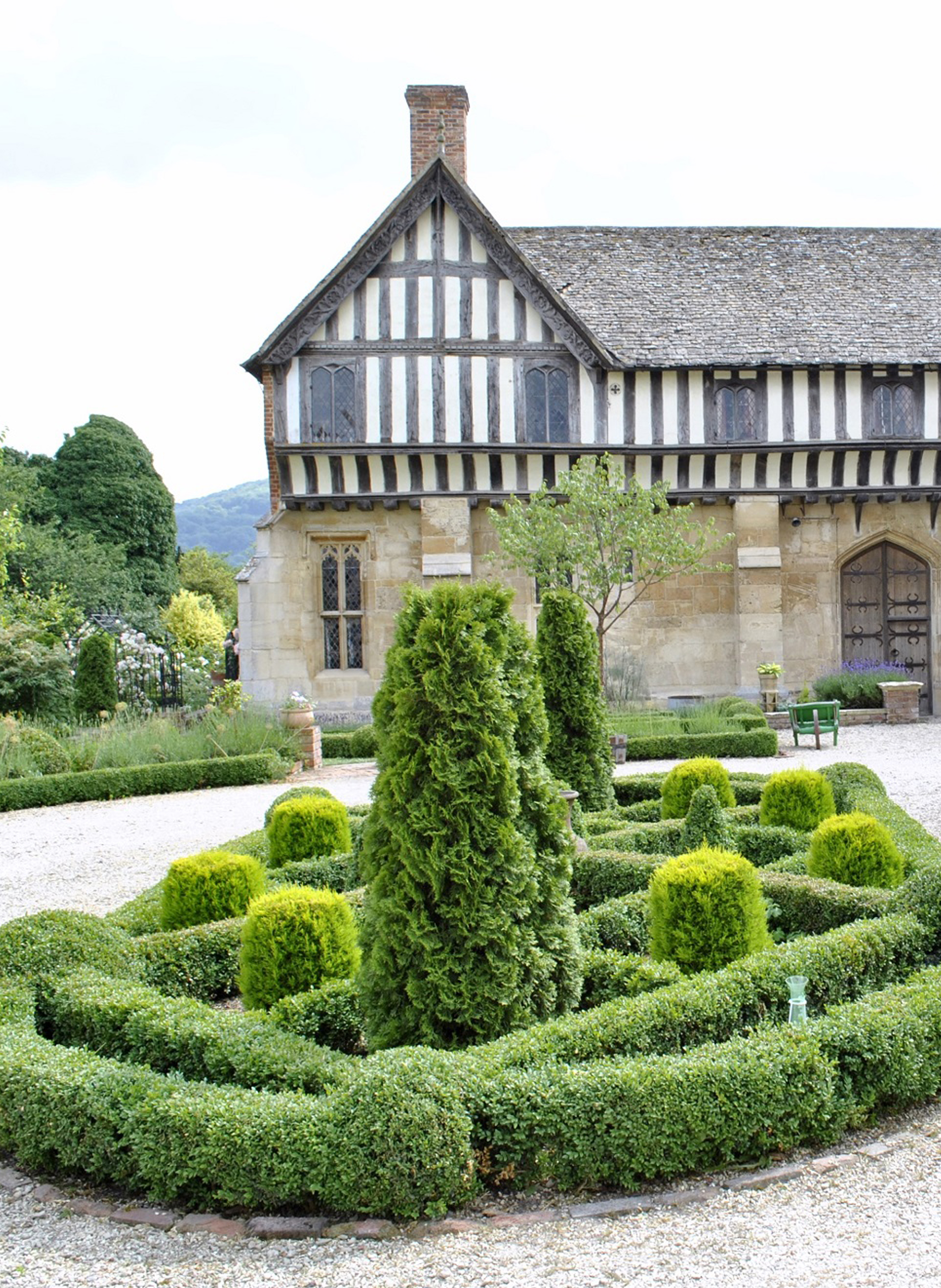 The beautiful forecourt garden display with Brockworth Court House in the background.