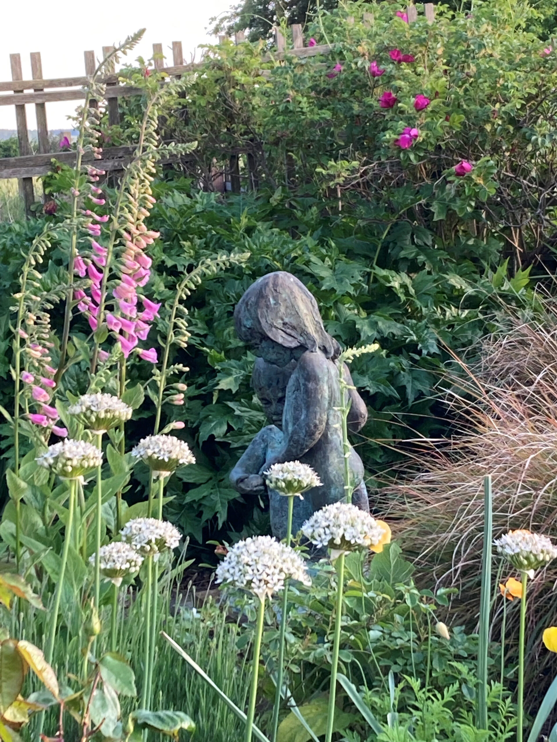 The beautiful Berkeley Castle gardens in the foreground with the castle in the background.le